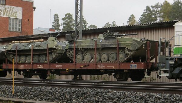 A Finnish BMP-1 TJJ artillery observation vehicle (right) and a MT-LBv armoured personnel carrier (left) - Sputnik International