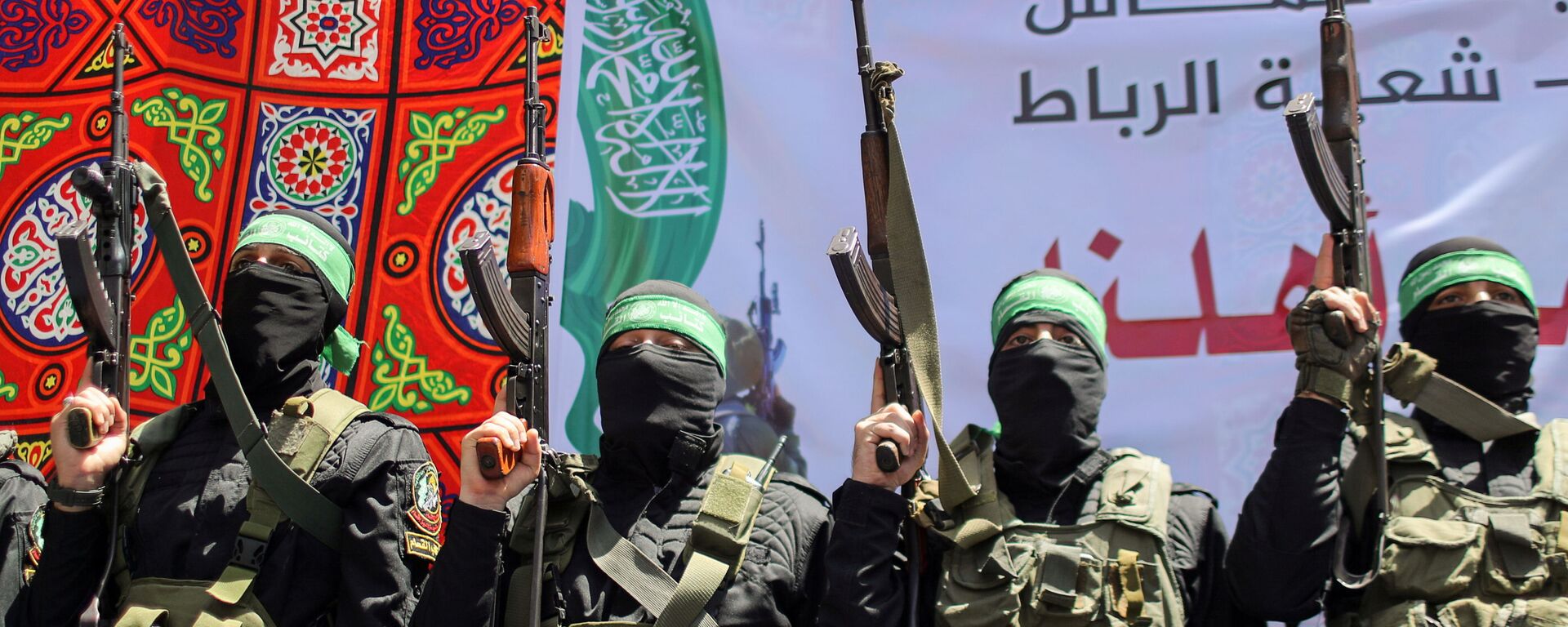 Palestinian Hamas militants take part in a protest over the possible eviction of several Palestinian families from homes on land claimed by Jewish settlers in the Jerusalem's Sheikh Jarrah neighbourhood, in the northern Gaza Strip May 7, 2021 - Sputnik International, 1920, 19.05.2021