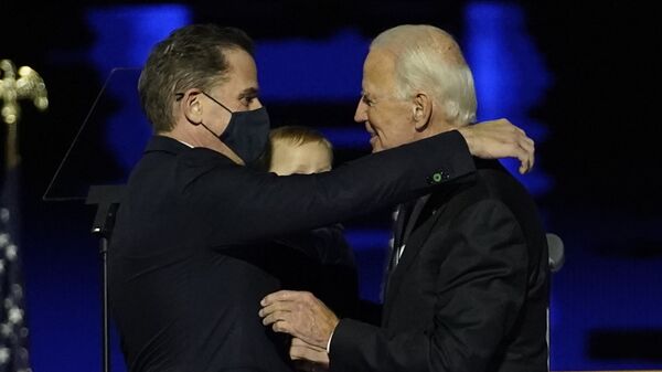 President-elect Joe Biden, right, embraces his son Hunter Biden, left, Saturday, Nov. 7, 2020, in Wilmington, Del. - Sputnik International