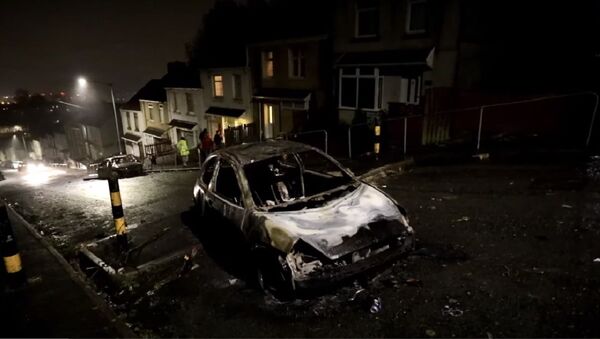 Gangs of young people have set cars on fire and rolled them down a hill in Swansea, Wales UK - Sputnik International