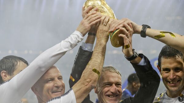 France head coach Didier Deschamps holds the World Cup after defeating Croatia in the 2018 final in Moscow. - Sputnik International