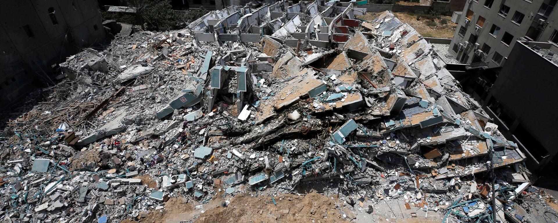 A view shows the remains of a tower building destroyed by Israeli missile strikes in the recent cross-border violence between Palestinian militants and Israel, following Israel-Hamas truce, in Gaza City May 21, 2021 - Sputnik International, 1920, 02.02.2022