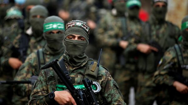 Palestinian Hamas militants take part in an anti-Israel rally in Gaza City May 22, 2021. REUTERS/Mohammed Salem - Sputnik International
