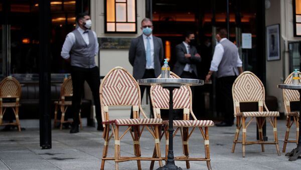 Tables are set on a terrace of a cafe during preparations for the reopening of restaurants and bars in Paris as part of an easing of the country's lockdown restrictions amid the coronavirus disease (COVID-19) outbreak in France, May 18, 2021.  - Sputnik International