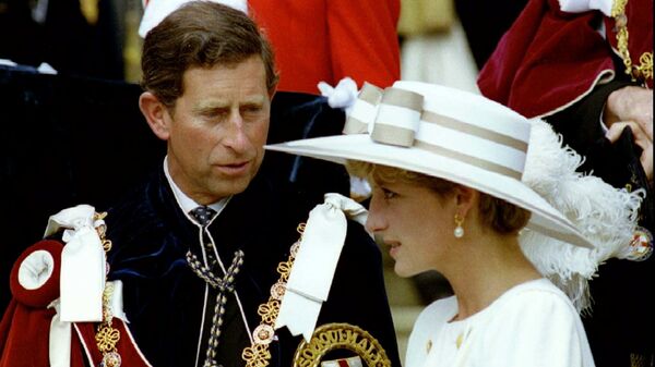 Prince Charles looks towards Princess Diana as they await their carriage to depart the Order of the Garter ceremony at Windsor Castle June 15, 1992 - Sputnik International