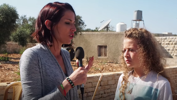 Journalist Abby Martin interviews 16-year-old Palestinian freedom fighter Ahed Tamimi in 2018 in Nabi Salih, West Bank - Sputnik International