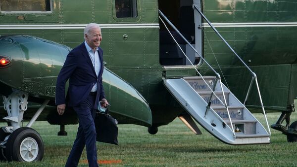 U.S. President Joe Biden walks from Marine One to a motorcade after a weekend trip to Camp David at the Ellipse near the White House in Washington, U.S., May 23, 2021. - Sputnik International