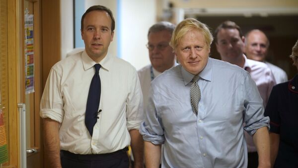 Secretary of State for Health and Social Care Matt Hancock, left, and Prime Minister Boris Johnson visit Bassetlaw District General Hospital, during their General Election campaign in Worksop, England, Friday, Nov. 22, 2019.  - Sputnik International