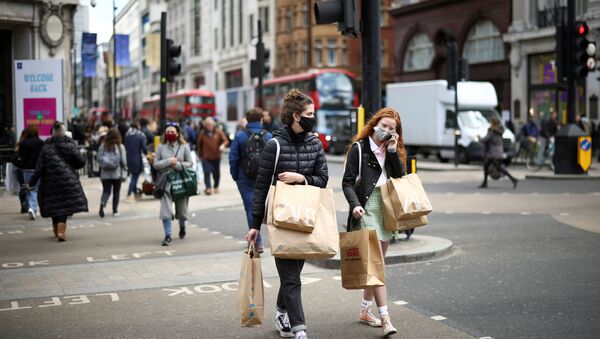 People walk at Oxford Street, as the coronavirus disease (COVID-19) restrictions ease, in London, Britain April 12, 2021 - Sputnik International