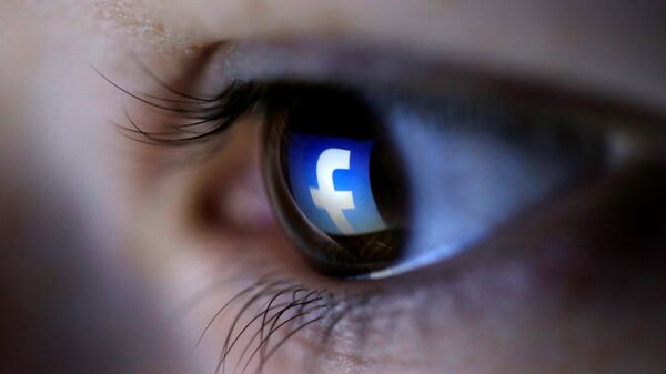 A picture illustration shows a Facebook logo reflected in a person's eye, in Zenica, March 13, 2015 - Sputnik International