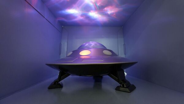 The Cosmic UFO, by Cloud b, that features moving projections of the Norther Lights, is demonstrated at the TTPM Holiday Showcase, in New York, Wednesday, Oct. 1, 2014. - Sputnik International