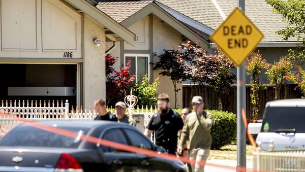 Emergency responders leave a home, rear, being investigated in connection to a shooting at a Santa Clara Valley Transportation Authority (VTA) facility, Wednesday, May 26, 2021, in San Jose, Calif. - Sputnik International