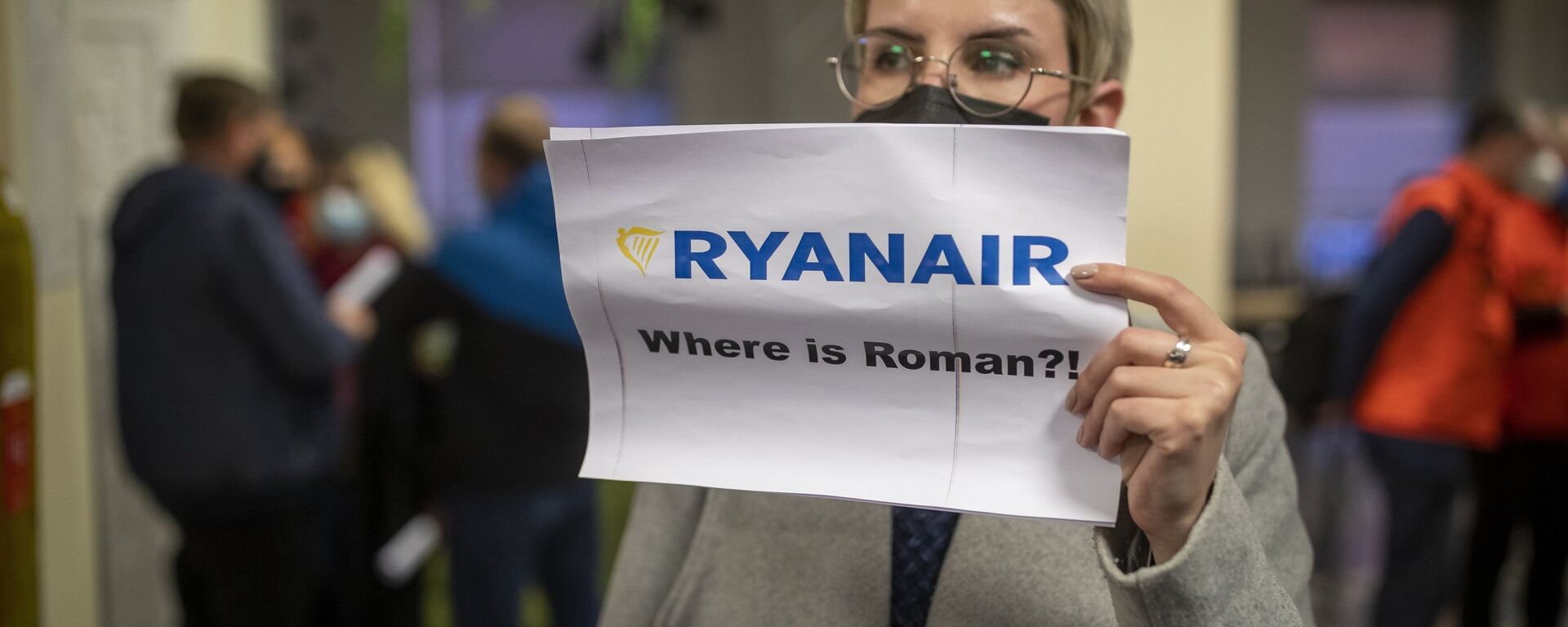 A woman holds a poster reads where is Raman Pratasevich?! as she waits to see passengers of the Ryanair plane with registration number SP-RSM, carrying opposition figure Raman Pratasevich which was traveling from Athens to Vilnius and was diverted to Minsk after a bomb threat, after its landing at the International Airport outside Vilnius, Lithuania, Sunday, May 23, 2021 - Sputnik International, 1920, 23.08.2021