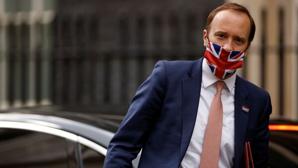 Britain's Health Secretary Hancock walks outside Downing Street in London - Sputnik International