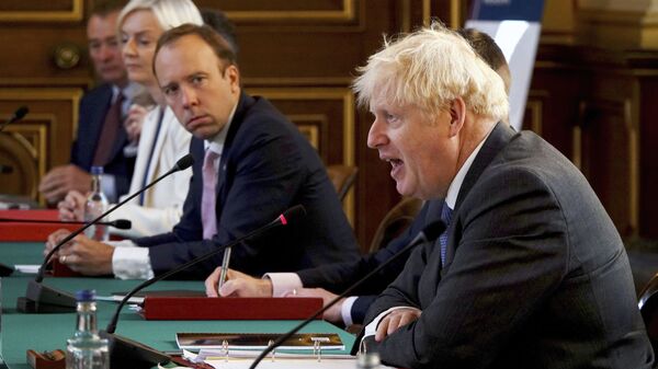 Britain's Prime Minister Boris Johnson, right, chairs a socially distanced government Cabinet meeting at the Foreign and Commonwealth Office (FCO) in London, Tuesday Sept. 15, 2020. - Sputnik International