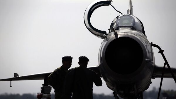 In this Wednesday, April 6, 2016 photo, ground crew prepares a Mig 21 fighter jet for a flight at the military airport Batajnica, near Belgrade, Serbia - Sputnik International