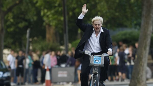 Boris Johnson Mayor of London waves to the media as he helps launch a new cycle hire scheme in London, Friday, July 30, 2010 - Sputnik International