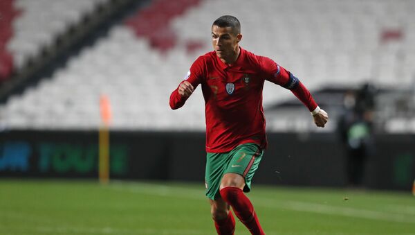 Portugal's Cristiano Ronaldo runs with the ball during the UEFA Nations League soccer match between Portugal and France at the Luz stadium in Lisbon, November 2020 - Sputnik International