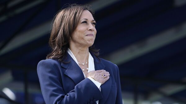 Vice President Kamala Harris stands during the National Anthem at the graduation and commissioning ceremony at the U.S. Naval Academy in Annapolis, Md., Friday, May 28, 2021 - Sputnik International