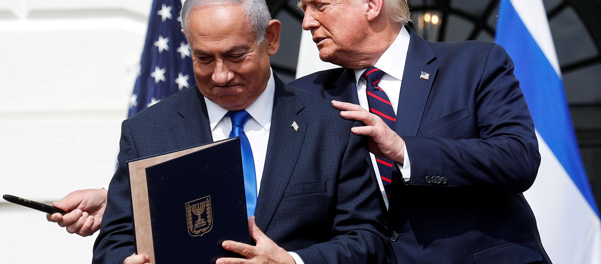 Israel's Prime Minister Benjamin Netanyahu stands with U.S. President Donald Trump after signing the Abraham Accords, normalizing relations between Israel and some of its Middle East neighbors,  in a strategic realignment of Middle Eastern countries against Iran, on the South Lawn of the White House in Washington, U.S., September 15, 2020. - Sputnik International, 1920, 08.07.2021