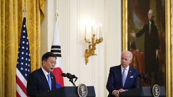 In this May 21, 2021, file photo, President Joe Biden listens as South Korean President Moon Jae-in speaks during a joint news conference in the East Room of the White House, in Washington. - Sputnik International