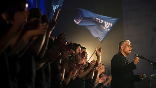 Yair Lapid, head of Yesh Atid party, speaks to supporters during a conference in Holon near Tel Aviv, Israel  - Sputnik International