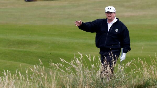 U.S. President Donald Trump gestures as he walks on the course of his golf resort, in Turnberry, Scotland  July 14, 2018.   - Sputnik International