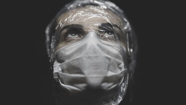 Portrait of a woman wearing mask - Sputnik International