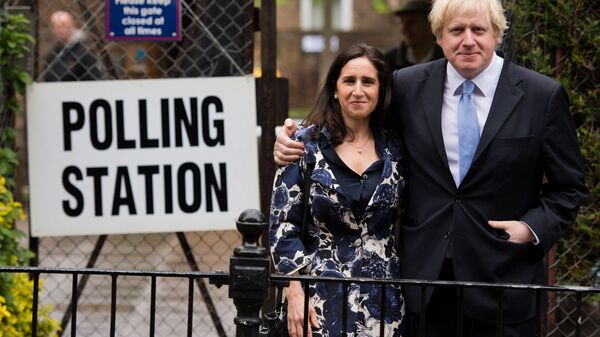 London Mayor Boris Johnson (R) stands with his wife Marina Wheeler (L) after casting his vote in the local elections - Sputnik International