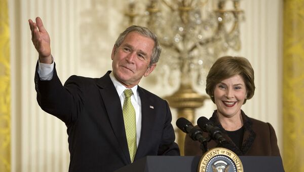 US President George W. Bush (L) and First Lady Laura Bush speak during a National Adoption Day event in the East Room of the White House in Washington, DC, 16 November 2007.   - Sputnik International