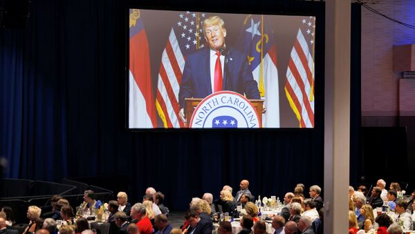 Former U.S. President Donald Trump appears on a giant live video screen as he speaks at the North Carolina GOP convention dinner in Greenville, North Carolina, U.S. June 5, 2021 - Sputnik International