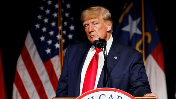 Former U.S. President Donald Trump pauses while speaking at the North Carolina GOP convention dinner in Greenville - Sputnik International