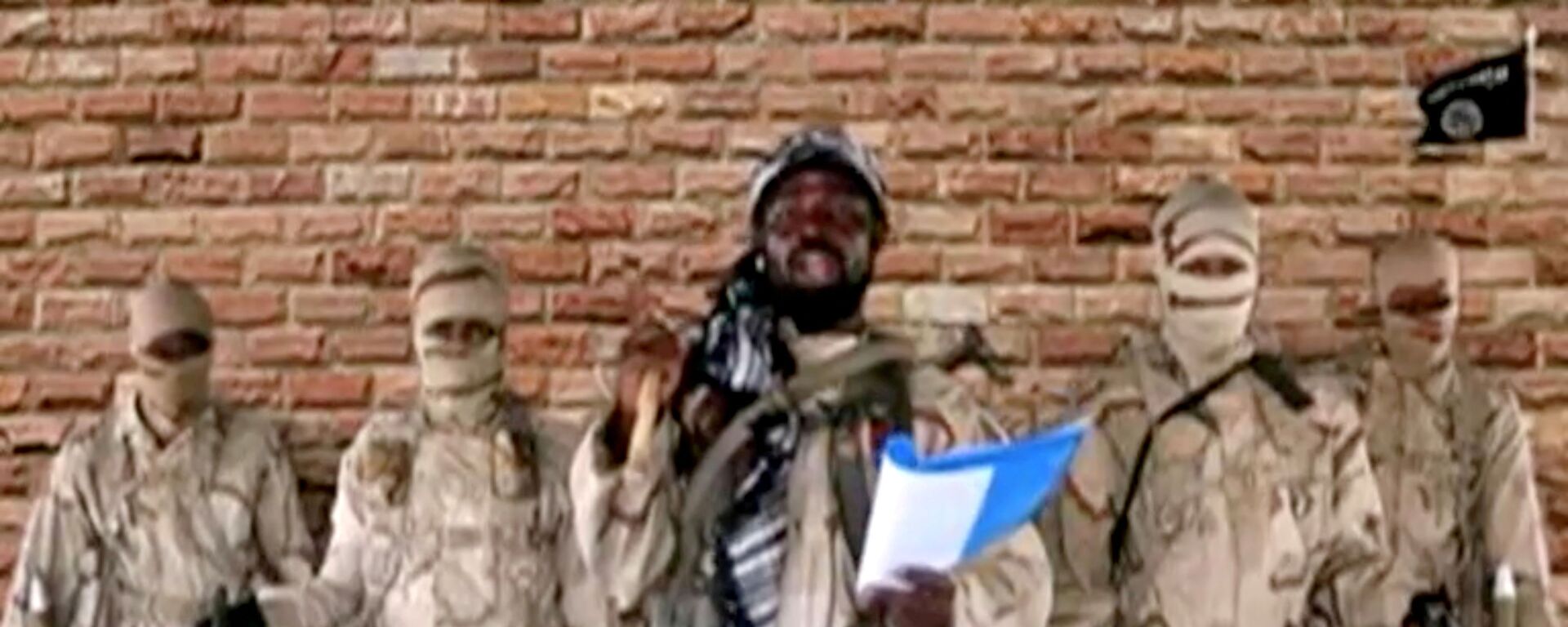 Boko Haram leader Abubakar Shekau speaks in front of guards in an unknown location in Nigeria in this still image taken from an undated video obtained on January 15, 2018. - Sputnik International, 1920, 06.06.2021