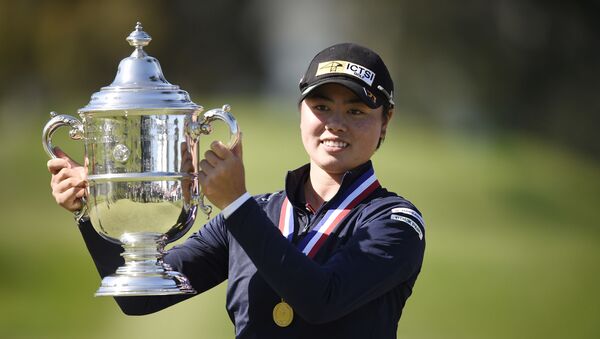 Yuka Saso hoists the US Open trophy after winning in a sudden death playoff over Nasa Hataoka following the final round of the U.S. Women's Open golf tournament at The Olympic Club, Jun 6, 2021 - Sputnik International