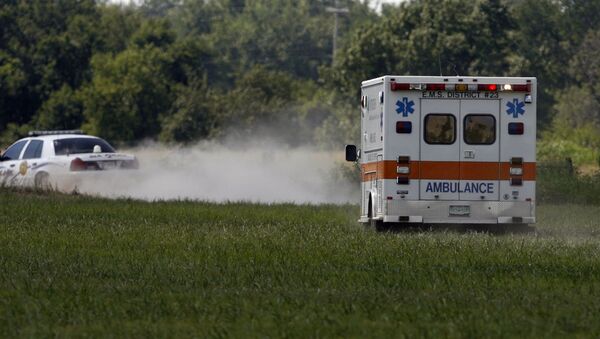MIAMI, OK - JULY 23:  The ambulance carries thirty eight year old Trigger Gumm, who crashed while attempting a 315-foot motorcycle jump on a 450cc Service Honda outfitted with a custom-built 4-stroke engine at Buffalo Run Casino, July 23, 2006 in Miami, Oklahoma. If not for the crash, the jump would have been a world record with the length of more than a football field. After the crash, Gumm was able to walk to the medical car that transported him to a hospital for further evaluation. - Sputnik International