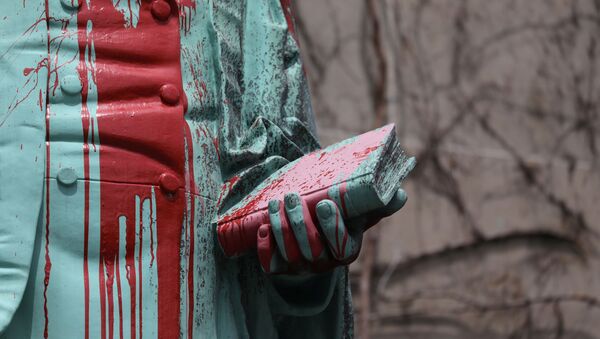 The defaced Ryerson University statue of Egerton Ryerson, who created the framework for Canada's residential indigenous school system, is seen following the discovery of the remains of 215 children on the site of British Columbia's former Kamloops Indian Residential School, in Toronto, Ontario, Canada June 3, 2021 - Sputnik International
