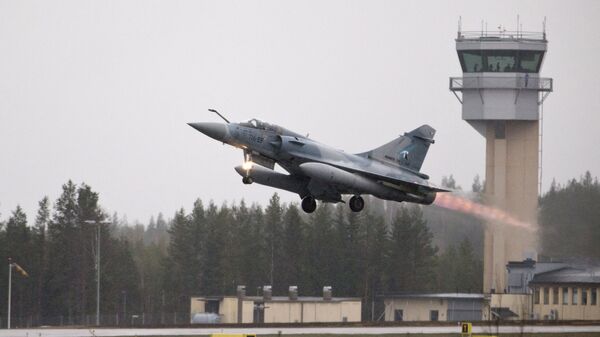 A French Mirage 2000 jet fighter takes off during the Arctic Challenge Exercise (ACE 2015) organized by Sweden, Finland and Norway in Rovaniemi, Finland on May 27, 2015.  - Sputnik International