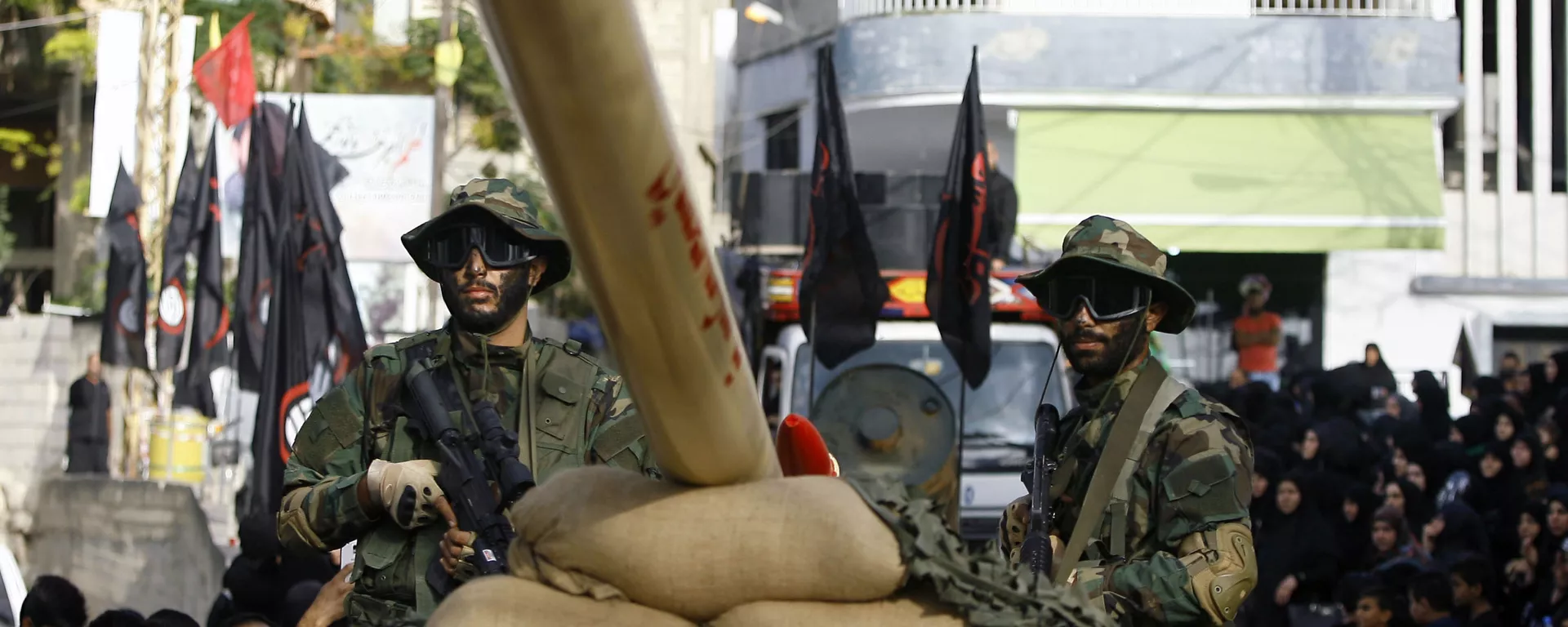 In this Sunday, Oct. 9, 2016 photo, Hezbollah fighters stand atop a car mounted with a mock rocket, as they parade during a rally to mark the seventh day of Ashoura, in the southern village of Seksakiyeh, Lebanon. - Sputnik International, 1920, 24.06.2024