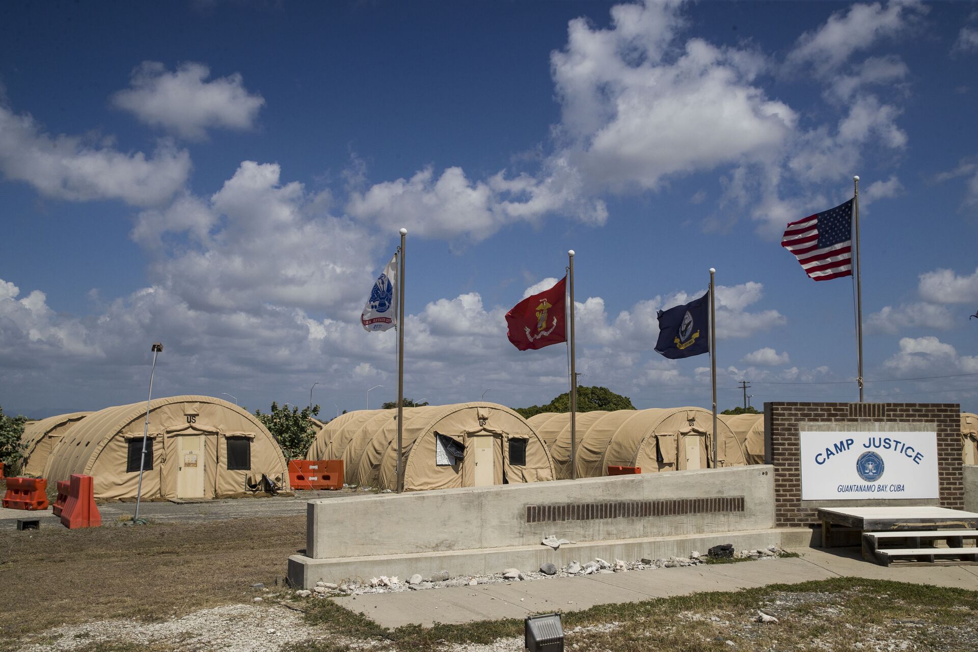 In this April 18, 2019, file photo, in this photo reviewed by U.S. military officials, flags fly in front of the tents of Camp Justice in Guantanamo Bay Naval Base, Cuba. - Sputnik International, 1920, 07.09.2021