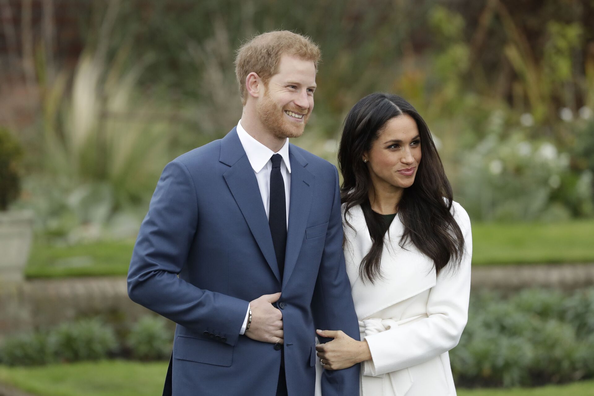 Britain's Prince Harry and his fiancee Meghan Markle pose for photographers during a photocall in the grounds of Kensington Palace in London, Monday Nov. 27, 2017 - Sputnik International, 1920, 01.12.2021