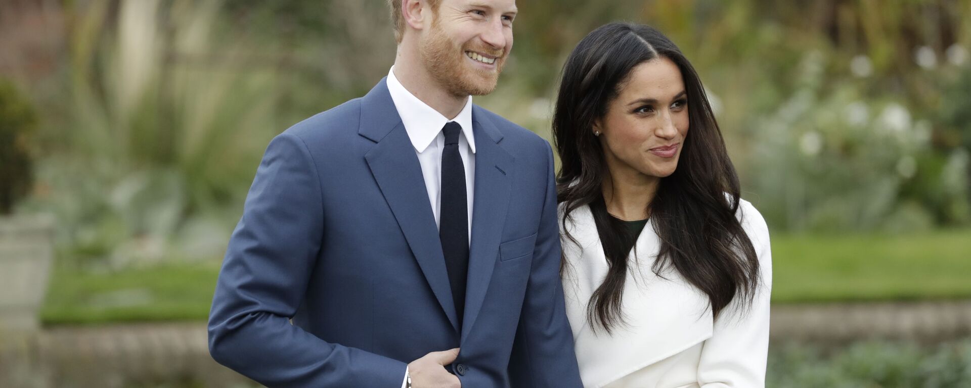 Britain's Prince Harry and his fiancee Meghan Markle pose for photographers during a photocall in the grounds of Kensington Palace in London, Monday Nov. 27, 2017 - Sputnik International, 1920, 07.02.2022