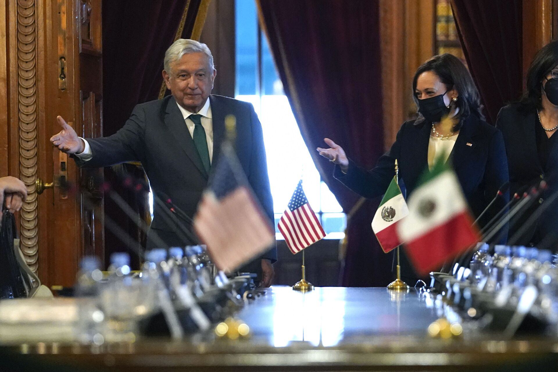 US Vice President Kamala Harris and Mexican President Andres Manuel Lopez Obrador gesture as they arrive for a bilateral meeting Tuesday, June 8, 2021, at the National Palace in Mexico City. - Sputnik International, 1920, 14.05.2022