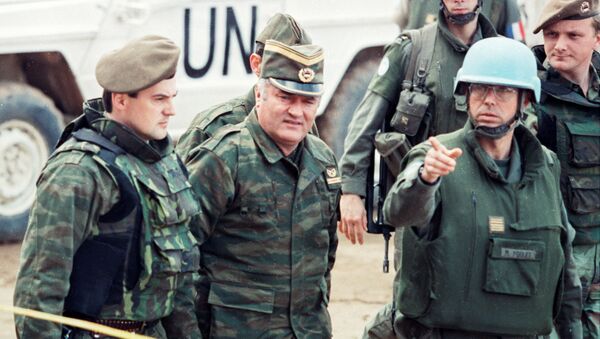 Bosnian Serb General Ratko Mladic is guided by a French Foreign Legion officer as he arrives at a meeting hosted by French U.N. commander General Philippe Morillon at the airport in Sarajevo, Bosnia and Herzegovina in March, 1993. - Sputnik International