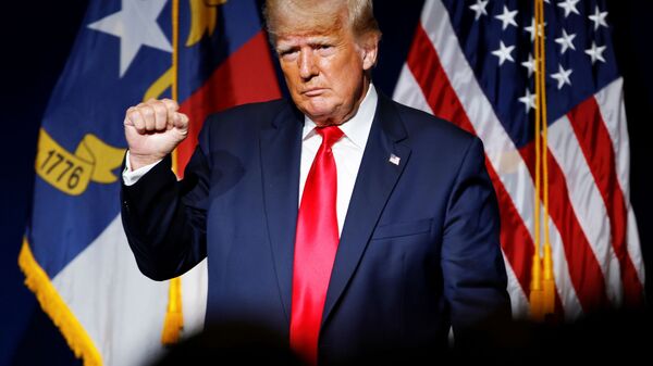 Former U.S. President Donald Trump makes a fist while reacting to applause after speaking at the North Carolina GOP convention dinner in Greenville, North Carolina, U.S. June 5, 2021. - Sputnik International