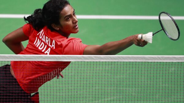 India's P.V. Sindhu returns the ball to Vietnam's Vu Thi Trang during their women's single badminton match at 18th Asian Games in Jakarta, Indonesia, Thursday, Aug. 23, 2018 - Sputnik International