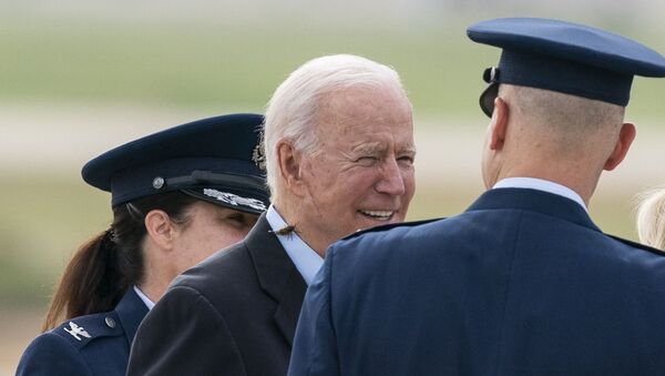 President Joe Biden, with a brood X cicada on his back, walks to board Air Force One upon departure, Wednesday, June 9, 2021, at Andrews Air Force Base, Md. Biden is embarking on the first overseas trip of his term, and is eager to reassert the United States on the world stage, steadying European allies deeply shaken by his predecessor and pushing democracy as the only bulwark to the rising forces of authoritarianism. - Sputnik International