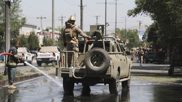 Afghan security personnel leave the scene of a roadside bomb explosion in Kabul, Afghanistan, Sunday, June 6, 2021. - Sputnik International