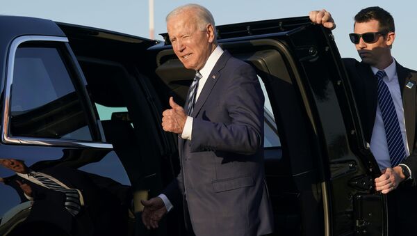 President Joe Biden steps into a motorcade vehicle after arriving at RAF Mildenhall in Suffolk, England, Wednesday, June 9, 2021. - Sputnik International