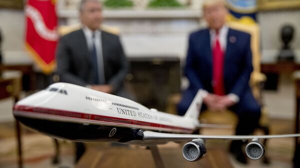 A model of the new Air Force One design sits on a table as President Donald Trump, right, meets with Colombian President Ivan Duque, left, in the Oval Office of the White House, Monday, March 2, 2020, in Washington. - Sputnik International