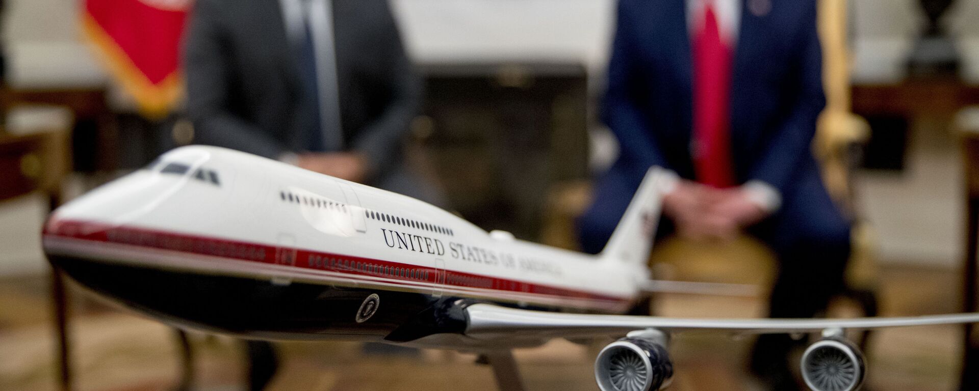 A model of the new Air Force One design sits on a table as President Donald Trump, right, meets with Colombian President Ivan Duque, left, in the Oval Office of the White House, Monday, March 2, 2020, in Washington. - Sputnik International, 1920, 10.06.2022